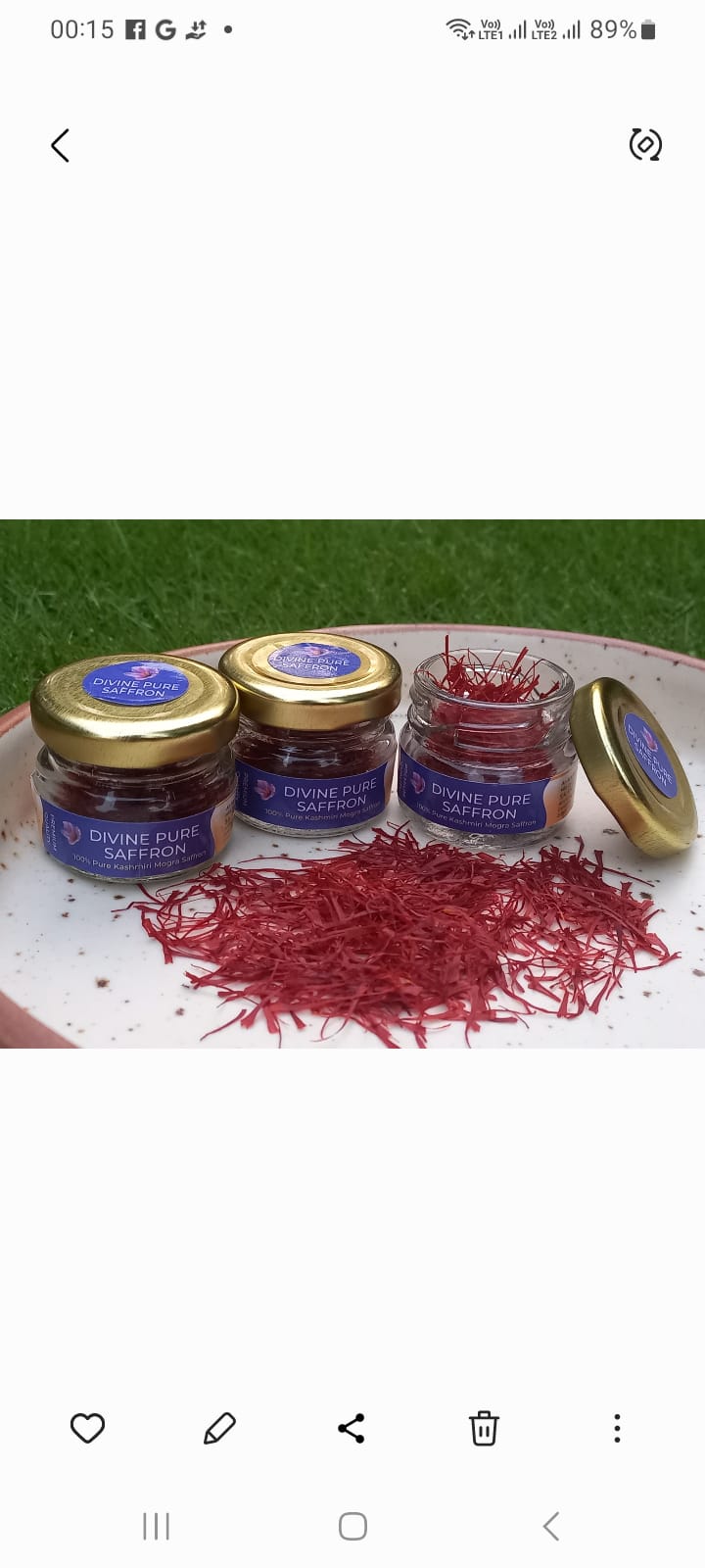 Three small jars with red powder on a white plate against a green background